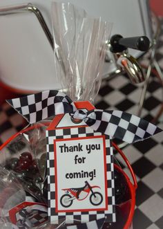 a basket filled with candies on top of a checkered table