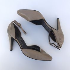 "Vintage Charles Jourdan Beige Taupe Tan ankle strap pumps sz 7 heel height: 3.75\" details: cut-out back of heel, gold accent details, gold hardware flaws: minor wear no marked size: 9.5\" heel to toe, approx sz 6.5 / 7 made in France Excellent Vintage Condition" Vintage Ankle Strap Court Shoes For Formal Occasions, Beige Ankle Strap Court Shoes With 4-inch Heel, Beige Ankle Strap Court Shoes For Evening, Beige Heels With Buckle Closure For Evening, Vintage Gold Ankle Strap Heels, Gold Slingback Pumps With Wrapped Heel And Ankle Strap, Gold Ankle Strap Slingback Pumps With Wrapped Heel, Gold Ankle Strap Court Shoes With 4-inch Heel, Gold Court Shoes With Ankle Strap And 4-inch Heel