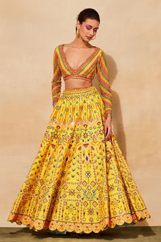 Yellow lehenga with geometric prints, cutdana, mirror embroidery and comes with separate cancan. Paired with leaf embroidered blouse.
Components: 3
Pattern: Printed, Embroidered
Type Of Work: Floral, Geometric
Neckline: V neck
Sleeve Type: Full
Fabric: Raw silk, cotton silk, Lining: Shantoon, mul
Color: Yellow
Other Details: 
Scallope detailing
Note: The yellow lehenga set shown in the image is only being sold
Occasion: Wedding - Aza Fashions Navratri Floor-length Dresses With Motifs, Bollywood Style Floor-length Sets With Motifs, Bollywood Floor-length Sets With Motifs, Floor-length Motif Dresses For Navratri, Floor-length Dresses With Motifs For Navratri, Festive Saree Skirt Set With Mirror Work, Yellow Mirror Work Sets For Reception, Bollywood Style Sets With Motifs For Navratri, Yellow Sets With Mirror Work For Reception