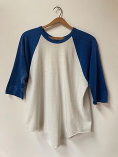 True vintage 1970's baseball Tee. A real classic beauty. Some possible bleaching of the sleeves as per pictures. PTP 20 1/2" Length: 27" (longest) 23" (shortest), Sleeve: 20" Tag: faded Fabric: 100% cotton No refunds, returns or exchanges. You have options in shipping. We will only ship outside of North America with tracking. Baseball Vintage, Baseball Shirt, Vintage Baseball, Baseball Shirts, Baseball T Shirts, Classic Beauty, Vintage 1970s, True Vintage, Baseball Tee