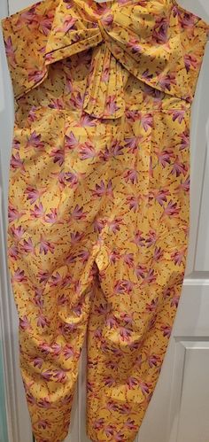 Such A Fun Jumpsuit, Wear It Belted Or Loose. A Summer Staple! Lying Flat The Chest Is 21", Waist Is 18", Hips Are 24" And The Inseam Is 28". Yellow Floral Print Vacation Pants, Fitted Yellow Pants For Vacation, Fitted Yellow Floral Print Pants, Printed Yellow Pants For Spring, Spring Yellow Printed Pants, Yellow Floral Print Sleeveless Jumpsuits And Rompers, Fitted Yellow Jumpsuits And Rompers With Floral Print, Yellow Floral Print Jumpsuits And Rompers, Fitted Printed Yellow Bottoms