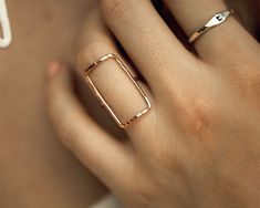 Our simple rings are handcrafted to perfection using the highest quality materials. This Bold Rectangle Ring is a stunning and powerful piece that’s destined to become an everyday favorite. At 1/2"X1”, this rectangle is a sweetly supersized version of our Open Rectangle Ring. The materials are delicate while the rectangular shape itself symbolizes strength. A light hammered texture gives off a glossy sparkle. For a bold design, this rectangle ring is also highly wearable. Select your Bold Rectan Rectangle Ring, Simple Rings, Initial Ring, Wide Band Rings, Bold Design, Classic Ring, Rings Simple, Wide Bands, Jewelry Care