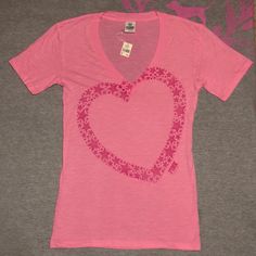 Pink Vintage Tee With A Heart Graphic Outlined In Stars And The Word Pink At The Bottom. Size Small, Brand New With Tags. Note The Retail Tag Is Attached By A Safety Pin. Tag Was Like This When Originally Purchased. Item Has Not Been Worn. Measurements Laying Flat Are About: Bust: 16” Length: 27” Waist: 16.5” Check Out My Closet For More Pink! Offers Welcome Or Bundle To Save! Fitted Pink T-shirt With Heart Graphic, Casual V-neck Top With Heart Print, Pink Fitted T-shirt With Heart Graphic, Spring V-neck Top With Heart Graphic, Spring V-neck Tops With Heart Graphic, Shoes List, Strawberry Soda, Rhinestone Tees, Baby Tee Shirts