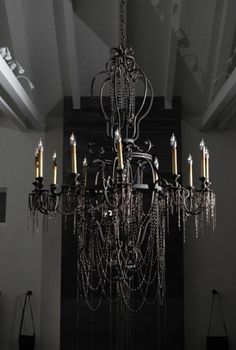 a chandelier hanging from the ceiling in a room