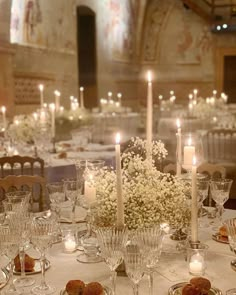 the table is set with candles and flowers