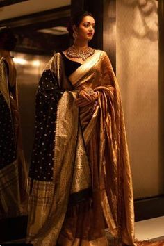 Gold toned choker with coin motifs, carved details and stone drops. Comes with carved round earrings and a ring.
Components: 1 Necklace, Pair of Earrings, 1 Ring
Type: Stones
Composition: Silver
Color: Gold
Carved details
Adjustable ring
Size (inch):
Necklace: 12
Earrings: 2.5 - Aza Fashions Actresses In Saree, Indian Lengha, Indian Sari Dress, Classic Closet, Banarsi Saree, Wedding Sari, Wedding Saree Collection, Saree Poses, Sari Dress