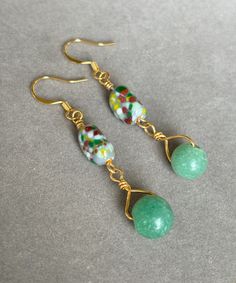 Lively multicolored glass beads are a party on your ears! A gemstone aventurine bead is dangled from the confetti-flavored beads by gold filled wire. 2 inches long including high quality gold filled ear wires. Ear wires can be changed to surgical steel at no additional charge if needed. Green Czech Glass Beaded Earrings, Wire Wrapped, Green Wire Wrapped Beaded Earrings With Czech Glass, Green Wire Wrapped Czech Glass Beaded Earrings, Green Beaded Dangle Earrings With Natural Stones, Green Glass Beaded Dangle Earrings, Green Czech Glass Earrings With Colorful Beads, Unique Green Czech Glass Beaded Earrings, Cream Yellow, Wire Jewelry