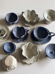 a table topped with lots of blue and white dishes