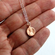 This tiny copper penny necklace is unique, simple, and very lucky! The penny can stand for good luck or can symbolize value and new beginnings. This little charm necklace is nice for everyday wear. You may choose your length of stainless steel or sterling silver chain. I prefer to use stainless steel because it is hypo-allergenic and perfect for sensitive skin. It also will never tarnish and is a strong, solid material that is still delicate and antiqued silver in color. The chain has a lobster Dainty Coin Charm Necklaces For Gifts, Dainty Coin Charm Necklaces As Gift, Coin Shaped Charm Necklace For Gift, Vintage Charm Coin Necklace With Round Pendant As Gift, Coin Shaped Charm Necklace Gift, Dainty Coin Charm Necklace Gift, Rose Gold Charm Necklace With Coin Pendant Gift, Rose Gold Coin Pendant Charm Necklace As Gift, Vintage Charm Coin Necklace As Gift