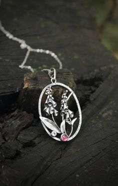 ITEM DESCRIPTION: The size H 5 cm x W 4 cm (2 x 1 1/3 inch). Weight - 5 g. You can buy it with a silver chain or without it. I made this Foxglow pendant of sterling silver, rhodolite and rose quartz. This flower pendant looks so touching and elegant. The botanical necklace is really worthy of being in your precious collection. Expect many compliments on this! This handmade necklace will come to you in a gift box - ready for gifting. The parcel will be sent 1-2 days after payment. Delivery usuall Sterling Silver Flower Pendant With Oxidized Finish, Flower-shaped Sterling Silver Jewelry With Oxidized Finish, Silver Sterling Flower Pendant Necklace, Handmade Sterling Silver Flower Necklace With Round Pendant, Silver Sterling Silver Pendant Flower Necklace, Silver Sterling Silver Flower Pendant Necklace, Flower Shaped Sterling Silver Jewelry With Oxidized Finish, Sterling Silver Oxidized Flower Jewelry, Sterling Silver Flower Jewelry With Oxidized Finish