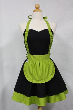 a green and black apron on a mannequin