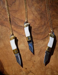 A beautiful folding knife necklace, crafted with stainless steel and brass and natural white shell abalone. These necklaces are unisex and the perfect gift. Coming hung on either a 14k gold filled chain or sterling silver of your desired chain length, please select from the drop down menu. Wear at your own risk, these knives are sharp - Make sure knife is folded close when wearing on neck to avoid injury. - Knife measures 6 cm long (when open) - Brass + Stainless Steel Knife with with Sterling S Pocket Knife Necklace, Blade Necklace, Knife Necklace, Necklace Shell, Cotton Jewelry, Bag Jewelry, Unisex Necklace, Safe Storage, Jewelry Essentials