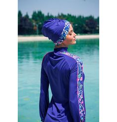 Two Piece Full Coverage Modest Swimsuit - M2228 Abstract Floral / Royal BlueThis stylish modest burkini swimsuit will keep you covered while enjoying your next beach vacation. Our swimwear is designed to be functional and cute while maintaining Islamic values of modesty.FEATURES:- Loose, modest fit- Mock neck- Zips partway down front of tunic- Ruched swim turban- Pants are straight fit with an elastic waistband- Includes tunic, pants, and swim turbanFABRIC:- Stretchy lycra- Hydrophobic- Water re Swim Turban, Burkini Swimsuit, Modest Fits, Modest Swimsuits, Abstract Floral, Beach Vacation, Mock Neck, Royal Blue, Loose Fitting