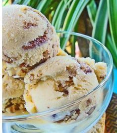 two scoops of ice cream in a glass bowl