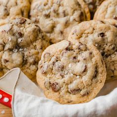 chocolate chip cookies sitting on top of a white cloth