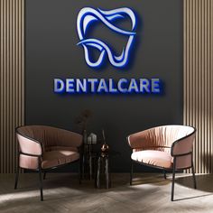 two chairs sitting next to each other in front of a sign that says dental care