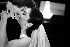 the bride and groom are kissing each other