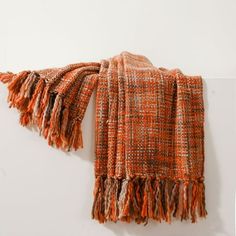 an orange scarf hanging on the wall