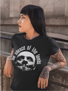 a woman wearing a black t - shirt with the words, the science of the mind on it