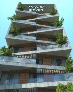 a tall building with lots of balconies and trees