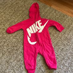 Never Worn Nike Onesie. In Excellent Condition. Willing To Negotiate Nike Casual Long Sleeve Onesie, Casual Pink Onesie For Winter, Casual Pink Winter Onesie, Casual Winter Pink Onesie, Casual Sports Onesie With Letter Print, Casual Pink Onesie With Letter Print, Casual Long Sleeve Onesie With Letter Print, Casual Pink Hooded Onesie, Casual White Onesie For Sports