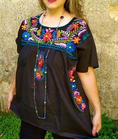 Beautiful BLACK Blouse,  bohemian and hippie fashion blouse, original design, colorful machine embroidery by Mexican artisans, cotton poplin fabric. Hand wash, do not tumble dry. 2xl chest 50 inches hips 54 inches length 29 inches 4xl chest 60 inches hips 61 inches lenght 31 inches Bohemian Peasant Top With Embroidered Neckline For Festivals, Bohemian Floral Embroidered Peasant Top For Festivals, Black Peasant Top For Festival, Black Bohemian Tops For Festivals, Black Embroidered Top For Summer Festival, Black Peasant Top With Floral Embroidery, Bohemian Festival Blouse With Floral Embroidery, Black Peasant Blouse With Floral Embroidery, Black Embroidered Peasant Top