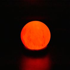 an orange object is glowing in the dark