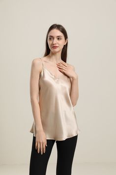 100% Mulberry Silk Breathable & Lightweight Lightweight & Comfortable Type: V Neck Silk CamisoleMaterial: 19Momme Charmeuse Silk Features: Satin, wear-resistant and stylish.Details: This light, regular fitted silk cami is a must-have, with its V-neck cut and adjustable straps to fit your preferred style. It is the perfect addition to any outfit, great for a night out, and can be paired with loungewear for a comfortable night in. Feminine Silk V-neck Tank Top, Elegant Solid Color Cami Top, Silk V-neck Tank Top For Night Out, Spring Satin V-neck Camisole, Elegant Solid Sleeveless Camisole, Elegant Solid Color Sleeveless Camisole, Feminine Silk V-neck Camisole, Elegant Sleeveless Solid Camisole, Silk V-neck Tank Top