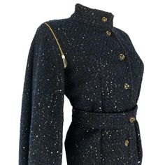 * Amazing design that can be worn 2 ways * Fitted Jacket with detachable cape style sleeves - can be worn as sleeveless jacket/vest * Beautiful black and navy woven boucle fabric with pewter colored sequins * Gold zipper details on sleeves * Fully lined * Button closure on front * Matching Waist belt with button closure Available Sizes: * Sizes: XS- XL * Sleeve Length: 25 inches * Buttons MAY vary due to availability *** Please allow up to 1 week for item to be completed. *** Winter Workwear Outerwear With Epaulettes, Fitted Evening Outerwear With Stand Collar, Fitted Outerwear With Stand Collar For Evening, Fitted Fall Outerwear With Epaulettes, Fall Workwear Outerwear With Epaulettes, Fall Outerwear With Stand Collar For Evening, Designer Winter Outerwear For Night Out, Winter Long Sleeve Outerwear With Epaulettes, Winter Outerwear With Epaulettes And Long Sleeves