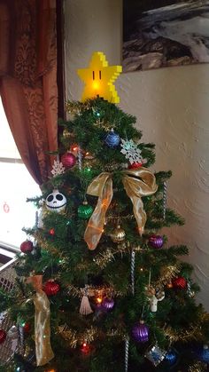 a decorated christmas tree with bows and decorations