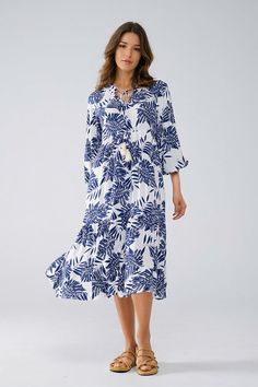 Step into boho elegance with our Boho Maxi Dress With Balloon Sleeves And Leaf Print In Navy and White. Crafted from 100% cotton, this dark blue and white midi dress offers a soft and breathable feel, making it ideal for spring and summer. The dress features a charming floral design and a flattering A-line cut that enhances your silhouette. The V-neckline can be tied at the neck with two strings that end in beautiful tassels, adding a touch of whimsy. The 3/4 length balloon sleeves and pom-pom d White Maxi Dress Boho, Fitted Midi Dress, White Midi, Boho Maxi, Boho Maxi Dress, White Midi Dress, Estilo Boho, Romper Pants, Leaf Print