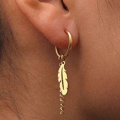 Introducing our exquisite Feather Earrings – a graceful and stylish addition to your jewelry collection that captures the essence of natural elegance. Each feather is intricately detailed, showcasing the fine craftsmanship and attention to detail that make these earrings truly unique. Specifications: Material: Stainless Steel Design: Dangling Feather Whether you're dressing up for a special occasion or adding a hint of nature-inspired sophistication to your everyday look, these earrings are the Elegant Single Leaf Earring, Elegant Hoop Earrings With Dangling Charms As Gift, Elegant Hoop Earrings With Dangling Charms For Gift, Elegant Feather Jewelry As Gift, Elegant Feather Jewelry Gift, Elegant Feather Jewelry For Gift, Elegant Hoop Earrings With Dangling Charms, Elegant Dangle Feather Earrings, Elegant Dangle Earrings With Feathers