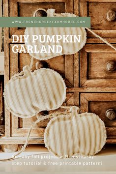 an old dresser with two pumpkins hanging from it's handles and the words diy pumpkin garland