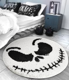 a bedroom with a mickey mouse rug on the floor