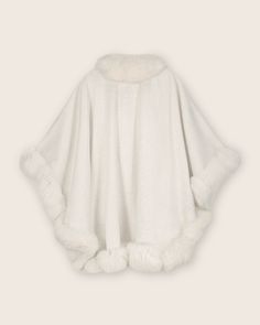 Our best-selling Cervinia cashmere cape is crafted with pure Mongolian cashmere and trimmed with real Finland fur. Featured on The Bachelorette with its glamorous silhouette, it's no wonder the Cervinia remains a customer favorite. 100% Mongolian cashmere Trimmed with dyed-to-match Finland fur. Luxury Wool Cape For Winter, Luxury Wool Winter Cape, Elegant Cashmere Winter Cape, Luxury Winter Poncho, Elegant Winter Cape Poncho, Luxury Cape With Faux Fur Trim, Elegant White Cashmere Outerwear, Elegant Winter Capelet, Elegant Fur Cape Coat With Faux Fur Trim