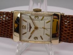 This is a beautiful mid-century 1954 Longines 17jewel wristwatch it triple brand marked.  The movement is a manual wind, 9LT, 17 jewel, marked Longines.  The beautiful egg shell white dial has slight blemishes and patina commensurate with its age and is marked Longines.  All three stick style hands and the hour markers are gold plated.  The two piece L&K case is gold filled and marked Longines and has light scratches commensurate with age. The back of the gold filled case is unmarked so it can b White Retro Formal Watch, White Retro Formal Watches, Retro White Watches For Formal Occasions, White Retro Watch For Formal Occasions, Egg Shell, Men Stylish Dress, 3 O Clock, Women Wrist Watch, Beautiful Watches