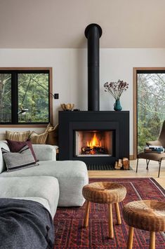 a living room filled with furniture and a fire place