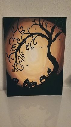 a painting of a tree with pumpkins on it