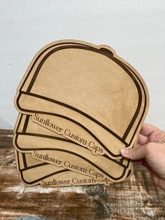 Personalized Wooden Hat Board for Trucker Hat Bars.  Made from splinter free wood. Perfect for your trucker hat bar, this hat board is personalized to contain your business name. This board gives customers the ability to visualize their own trucker hat. Each board mimics the size of a trucker hat, which helps to place patches perfectly before the heat press! For font requests to match your brand message me the font name. Hat Bar Display Ideas, Trucker Hat Bar, Bar Booth, Hat Bar, Brand Message, Personalized Hats, Bar Displays, Hat Patches, Hat Ideas