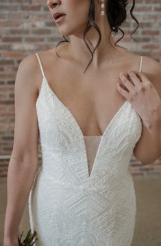 Lis Simon // Kendall - Ivory - Size 12 https://www.brickandbustlebridal.com/