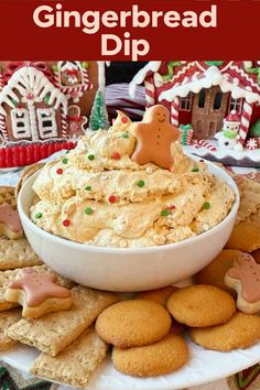 there is a bowl of gingerbread dip on the table with cookies and crackers