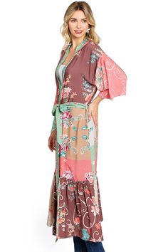 This stunning duster kimono features a classic longline silhouette with a ruffle panel along the bottom and a self tie belt at the waist. Soft floral mixed prints throughout. CARE | Hand Wash Cold or Dry Clean CONTENTS | 100% Viscose MEASUREMENTS | 48"/122 cm Top to Bottom (Size O/S) MODEL | 5'8 - wearing O/S IMPORTED Fitted Floral Print Kimono For Spring, Spring Floral Print Fitted Kimono, Spring V-neck Kimono With Belt, Summer Kimono With Tie Waist For Daywear, Summer Daywear Kimono With Tie Waist, Belted Kimono For Beach, Spring Long Belted Kimono, Bohemian Spring Kimono With Tie Waist, Spring Daywear Belted Kimono