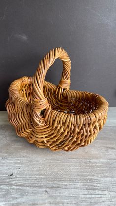 a wicker basket sitting on top of a wooden table