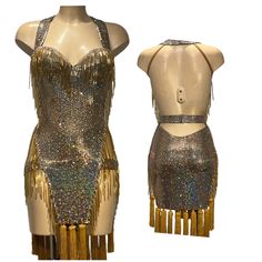 two mannequins with gold sequins on them, one in the shape of a dress