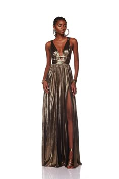 Embrace divine elegance in our Goddess Gown, featuring a captivating deep V-neck and a flattering belted waist. Crafted from lightweight metallic fabric and partially lined for comfort, it boasts a hidden back zipper closure and a mesmerizing split hem, perfect for any special occasion. Disco Gala, Bronx And Banco Dresses, Ravello Wedding, Goddess Gown, Bronx And Banco, Gold Maxi Dress, Gown Gold, Gold Gown, Career Girl