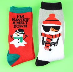 two socks that say i'm having a melt down and have snowmen on them