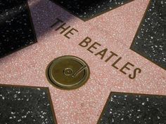 the star on the hollywood walk of fame with the name the beatles written on it