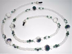 This listing is for a brand new handmade Erinite / White Alabaster Crystal Metallic Green Bead Mix Eyeglass Chain....It is made with 4mm Erinite Swarovski Bicone, 6mm White Alabaster Swarovski Bicone, 4x6mm & 8x10mm Opaque White w/ Half-coat Metallic Green Rondelles, 6/0 Matte White Glass Seed Beads....Total length is 27"....Chain weighs 0.7oz....Comes in organza bag....I do combine shipping....Please check out my store for more eyeglass chains and hundreds of other great items....Thanks for loo White Alabaster, Eyeglass Chain, Glass Seed Beads, Green Bead, Sunglasses Accessories, Seed Beads, Women's Accessories, Jewelry Watches, Beaded Necklace