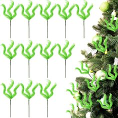 green christmas tree decorations with ornaments on them