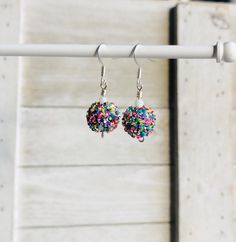 Chunky glitter confetti dangle earrings are girly pastel earrings that will make a fun birthday gift to wear on your special day!  Adorable 1" earrings * Just the right size for women or girls  * Fun glittery confetti earrings * Silver fish hook ear wires * Rubber back stoppers * Ships within 3-5 business days -- free tracking More Dangle Earrings https://www.etsy.com/shop/MiksJewelryShop?ref=seller-platform-mcnav&search_query=dangle+earrings My Jewelry Collection https://www.etsy.com/shop/MiksJewelryShop?ref=seller-platform-mcnav&section_id=27411989 Thank you for supporting handmade and for visiting my corner of the internet. Please message me with any questions you may have. - Mikaila Cheap Novelty Birthday Earrings, Novelty Multicolor Earrings For Birthday, Confetti Beaded Earrings, Multicolor Glitter Drop Earrings, Multicolor Glitter Dangle Earrings, Birthday Accessories, Pastel Earrings, Glitter Birthday, Glitter Confetti